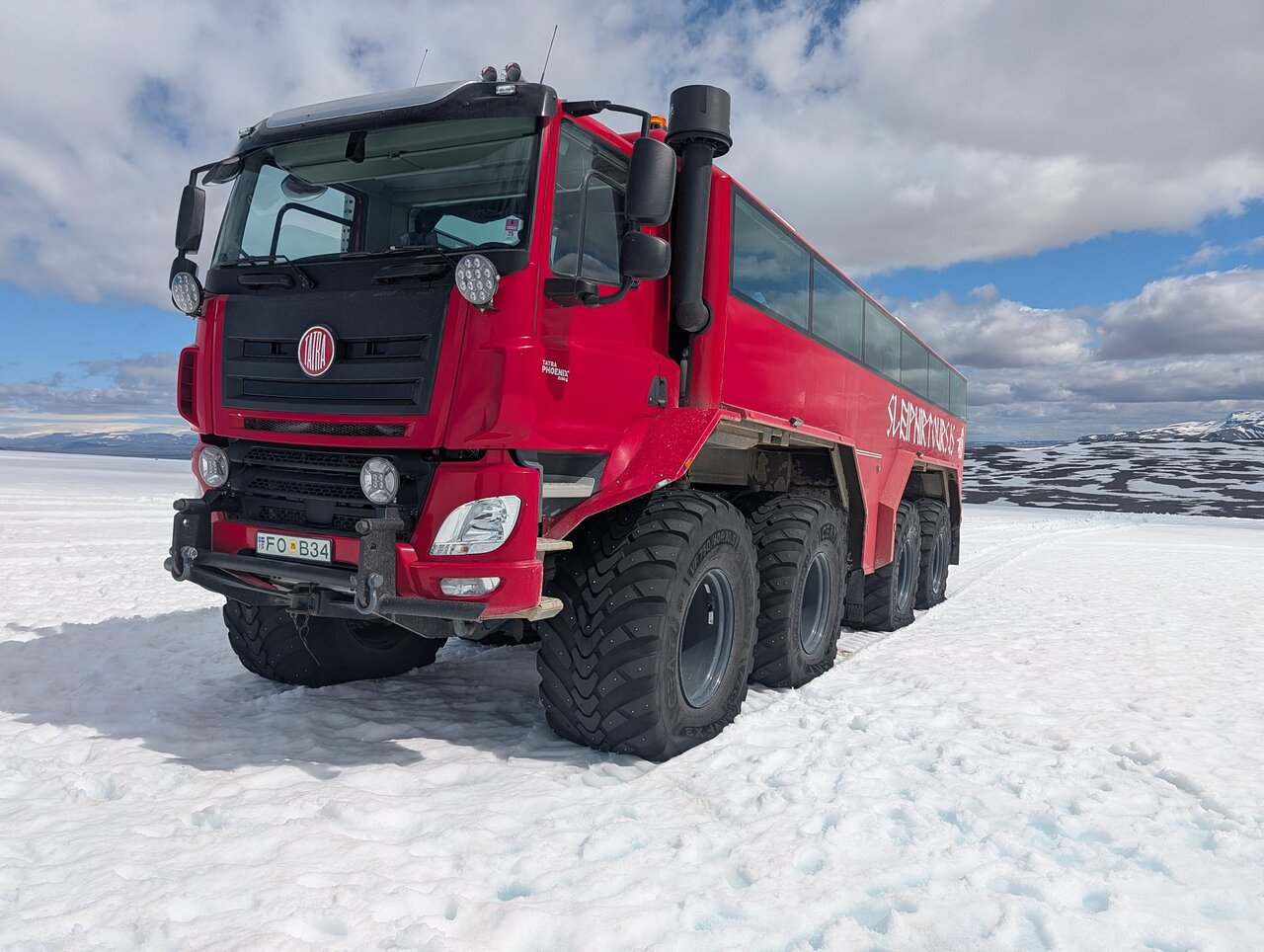 Red Glacier Monster Truck on Langjokull Glacier from Gullfoss